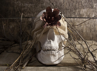 Skull and flower branches.
