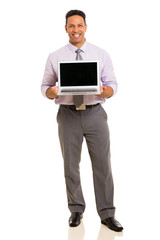 middle aged businessman presenting laptop