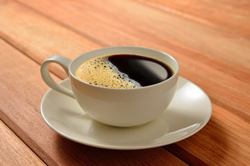 Cup of coffee  on wooden table