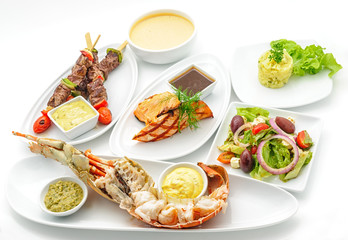 Set of international dishes arranged for catering, studio shot