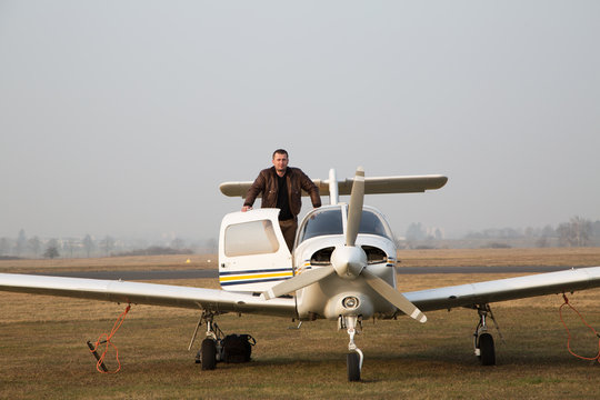Pilot with the aircraft  after landing.
