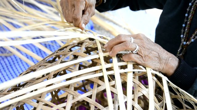 Weaving bamboo basket.