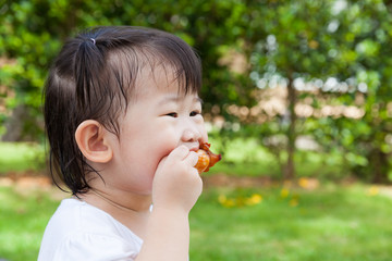 Closeup little asian (thai) girl enjoy eating her lunch