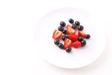 Fresh Berry Fruits on White Plate, Isolated on White Background.