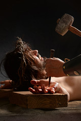 Jesus Being Nailed to the Cross