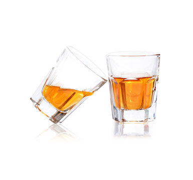 Whiskey in a shot glass isolated on a white background