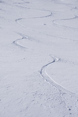 Tracks on a mountain Slope, freeride in deep snow