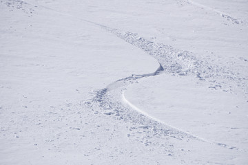 Tracks on a mountain Slope, freeride in deep snow