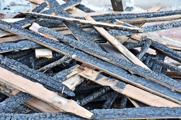Burned floor beam after conflagration in building