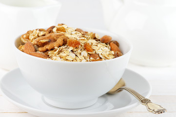 Oatmeal flakes with nuts in bowl