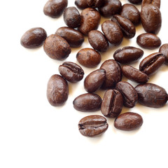 Brown coffee beans isolated on white background