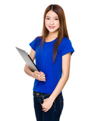 Attractive smiling young business woman holding laptop computer