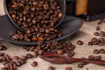 coffee beans in a coffee cup on sackcloth