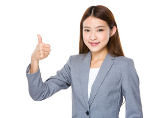 Asian woman with her thumb pointing up