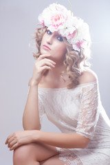 Beautiful girl with flowers in her hair. Spring.