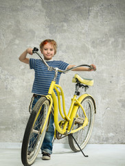 Fototapeta na wymiar Boy with bicycle