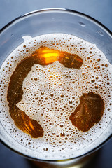 glass full of beer, view from above