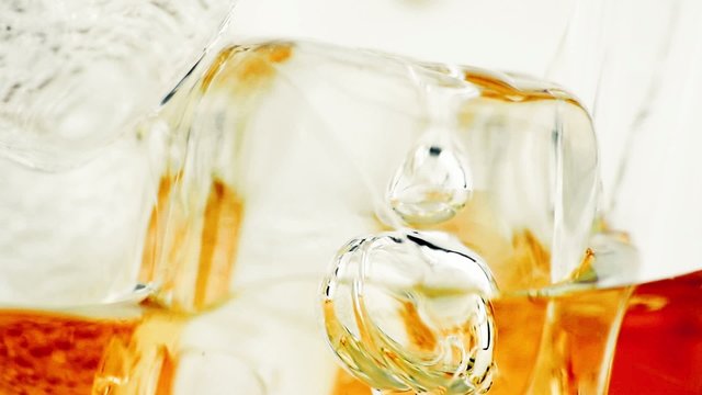 close-up of whiskey in glass with ice used for background