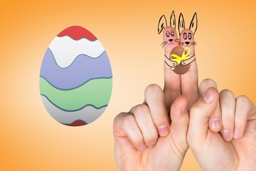 Composite image of fingers as easter bunny