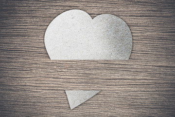 paper heart on wood background