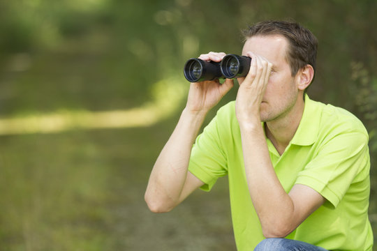 Enviromental Scientist Researching The Environment With A Binocu