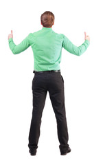 Back view of  business man shows thumbs up.