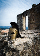 Spartan helmet on castle ruins