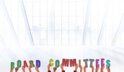 Composite image of hands holding board commitees