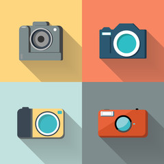 Set of photo cameras on color background.