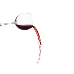 Glass with pours red wine