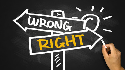 right or wrong signpost hand drawing on blackboard