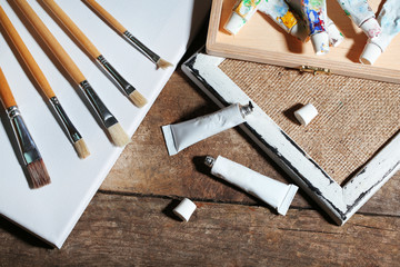 Professional art materials on wooden background
