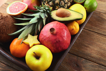 Assortment of fruits on wooden table