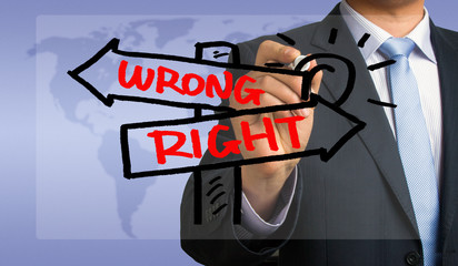 right or wrong signpost hand drawing by businessman