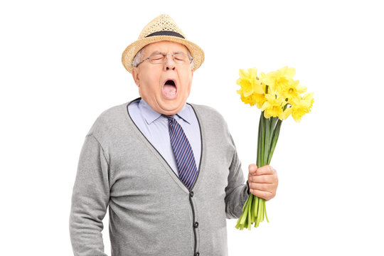 Senior having an allergic reaction to a bunch of tulips