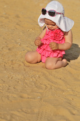 baby girl on the beach