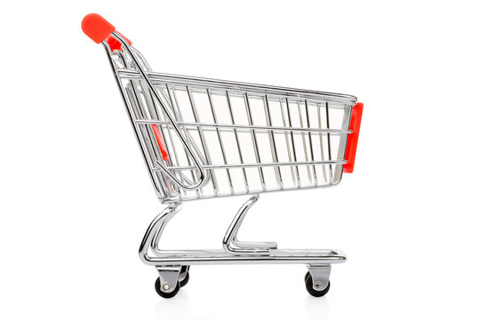 Red shopping cart on white, clipping path