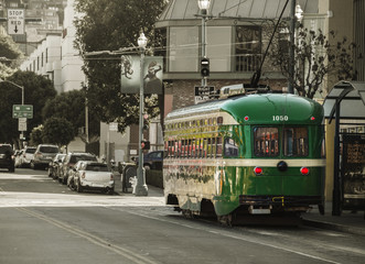 Fototapeta na wymiar Vintage Overhead Cable Retro Trolley Car moves through street