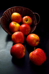 Apple in basket black background