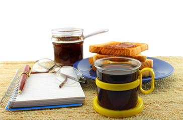 Notepad and pen on the breakfast