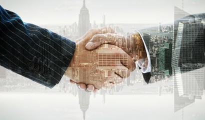 Fototapeta na wymiar Composite image of business people shaking hands