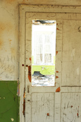 Old wooden door in abandoned house