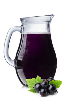 Fresh blackcurrant juice in a pitcher.