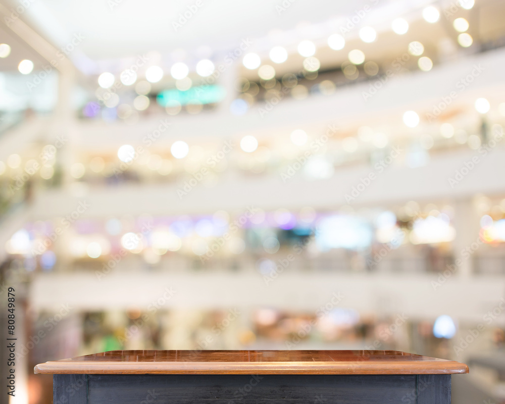 Poster empty wooden table top with blur store background ,template mock