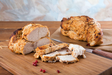 Roasted turkey breast on wooden plank