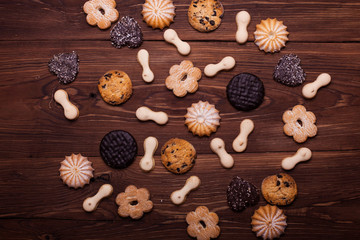 Various cookies on the wooden table