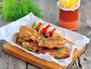 fried chicken wings with red sauce and French fries  potatoes