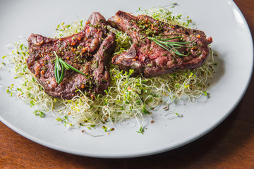 Rack of Lamb with Alfalfa seedlings