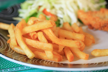 French fries and salad vegetables.
