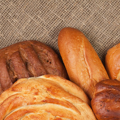 variety of fresh bread over sackcloth